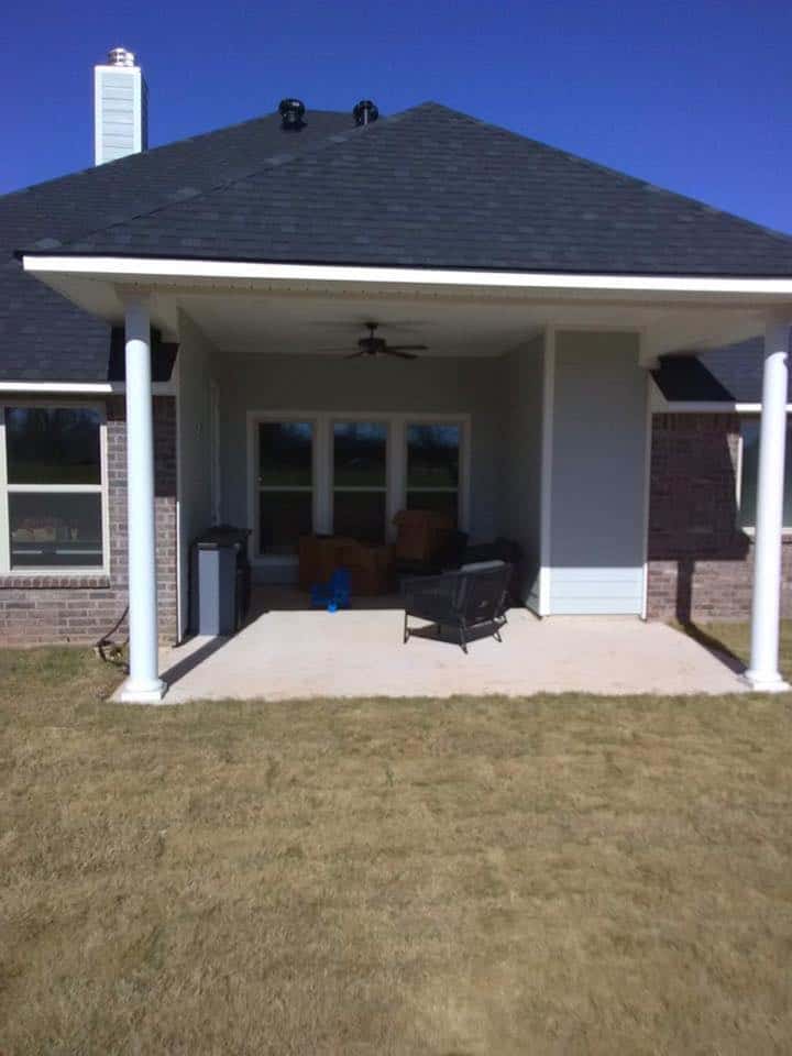 Covered back porch on a brick home