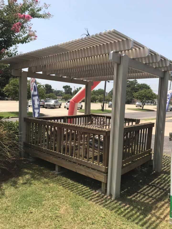 Lattice pergola over a wood deck
