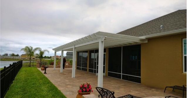 Enclosed patio on a tan home