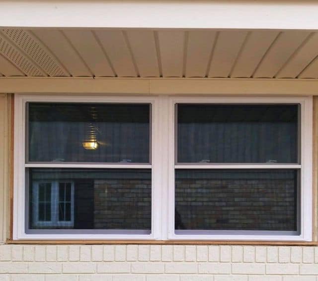 New double hung windows on a brick home