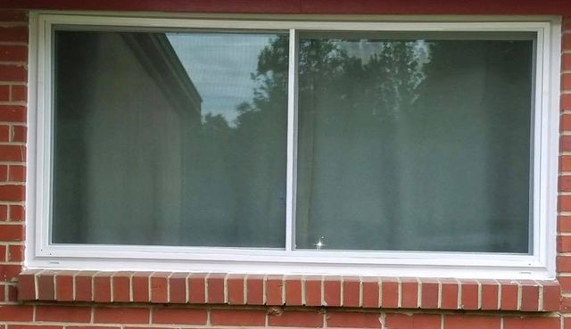 Replacement window on a red brick home